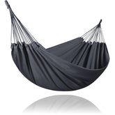 SUNCREAT hammock front view showing full dark gray bed and roomy surface