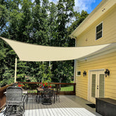TANG front view of beige 12x16 sun sail showing full canopy and neutral color benefits