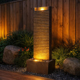 Teamson Home fountain front view showing ridged column and warm brown frame for focal impact