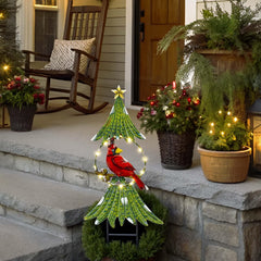 TERESA'S COLLECTIONS illuminated stake at night providing warm festive lighting