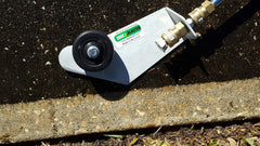 THE EDGE BLASTER cleaning a driveway edge demonstrating precise targeted cleaning