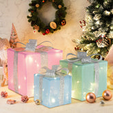 Threehoney front view of three pastel lighted gift boxes showing festive glow and neat presentation