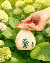 Tomarist mushroom waterer front view showing shape and charm for delicate watering