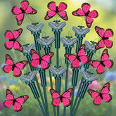 Tujoe front view of twelve pink butterfly stakes showing decorative layout benefit