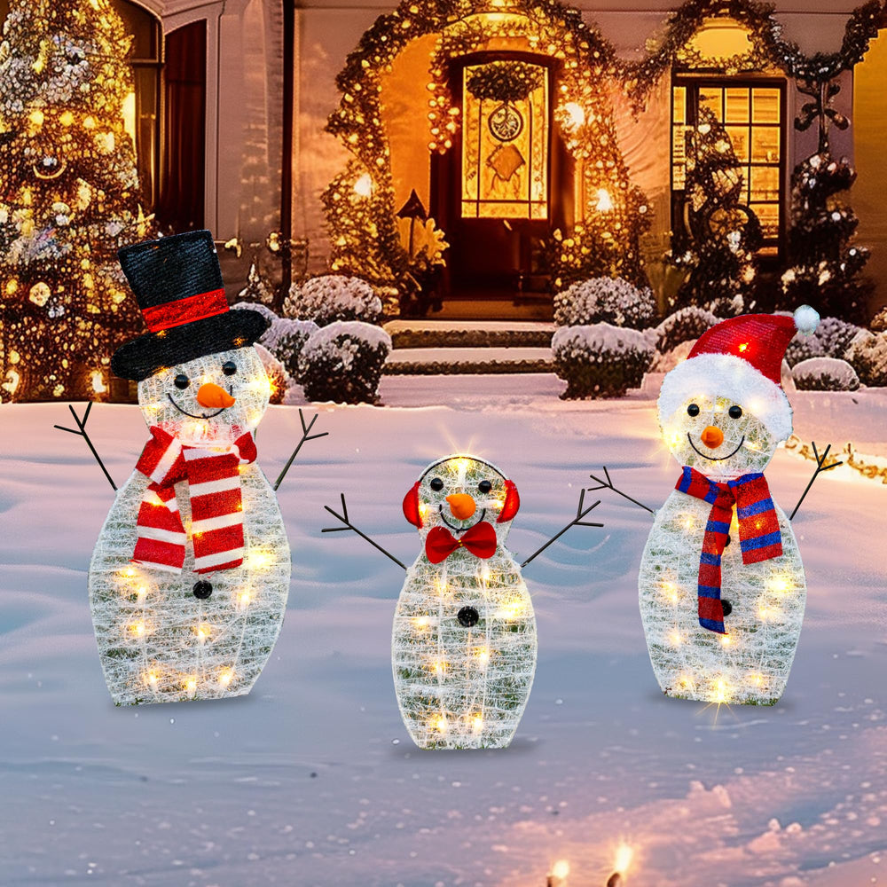 TW SHINE front view of three-piece snowman family showing festive decor and curb appeal