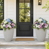 Ultym front view of beige fluted planter shows elegant entrance styling