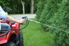 Valley Industries spray gun in use cleaning barn showing high flow and time-saving coverage