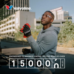 Valvoline bottle being poured into engine bay to improve protection