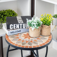 VCUTEKA styled on a balcony demonstrating compact size and decorative appeal