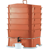 VermiHut front view showing terracotta five-tray unit and clean footprint benefit