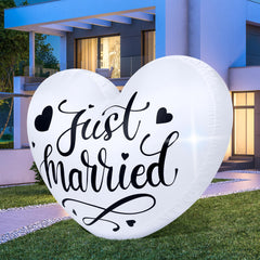 Vertintong front view of inflatable heart showing "Just Married" text and curb appeal