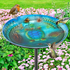 VeyFolzin.st front view of blue metal bird bath showing vintage shape and appeal