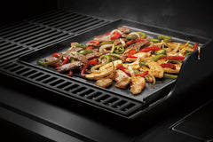 Weber Crafted griddle installed in grill enabling simultaneous cooking benefit