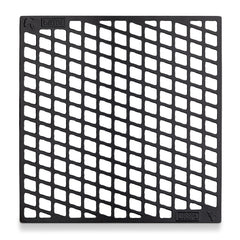 Weber close‑up of thicker bars delivering bold sear marks and heat contact