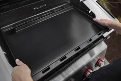 Weber griddle installed on a Spirit grill demonstrating easy conversion and expanded cooking area