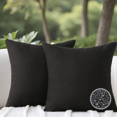 WHATWEARS front view of two black outdoor pillows showing finished look and curb appeal