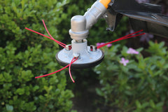 1-2-trim installed on gas trimmer demonstrating universal fit