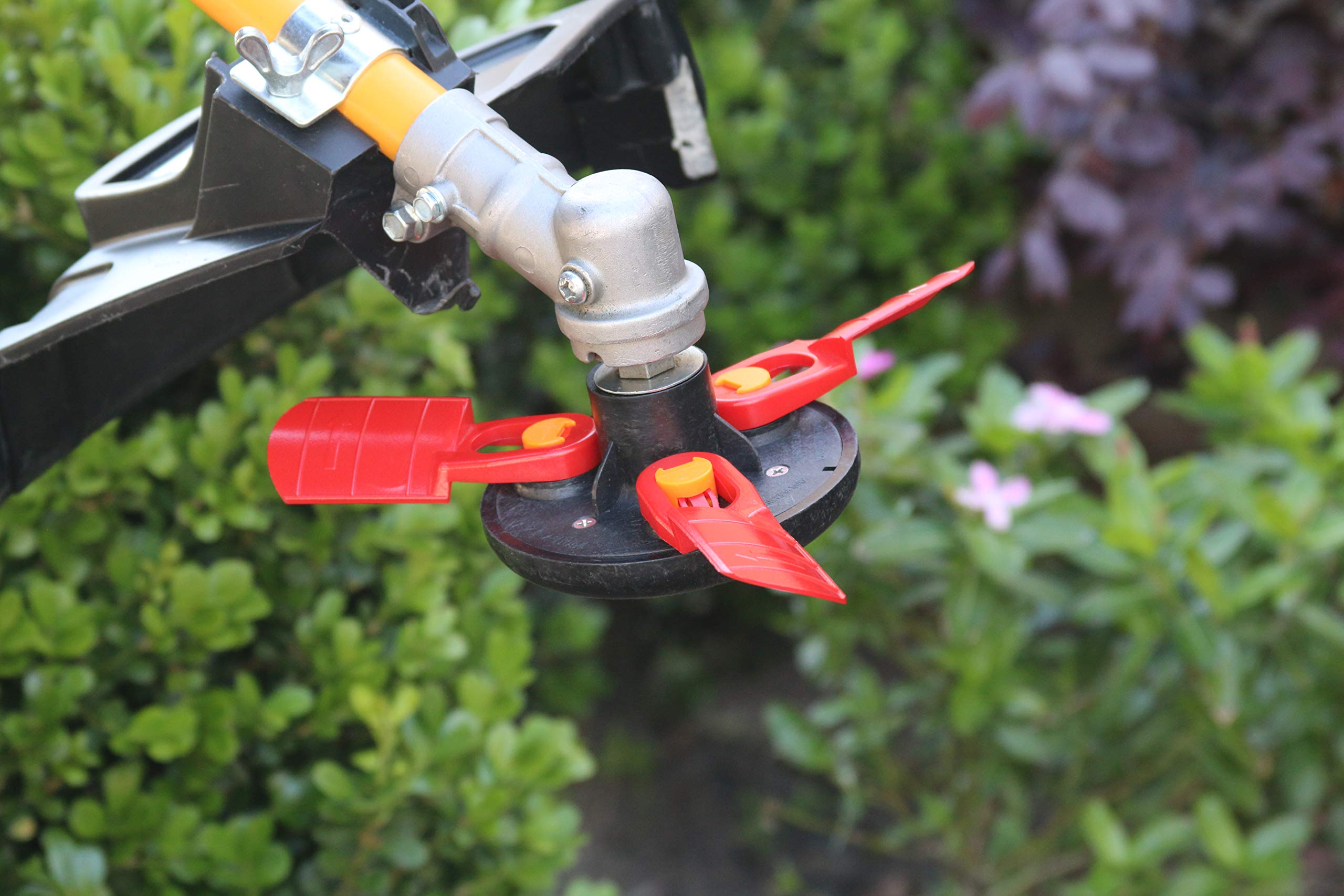 1-2-trim head held in hand for scale showing compact size and ergonomic handling benefit