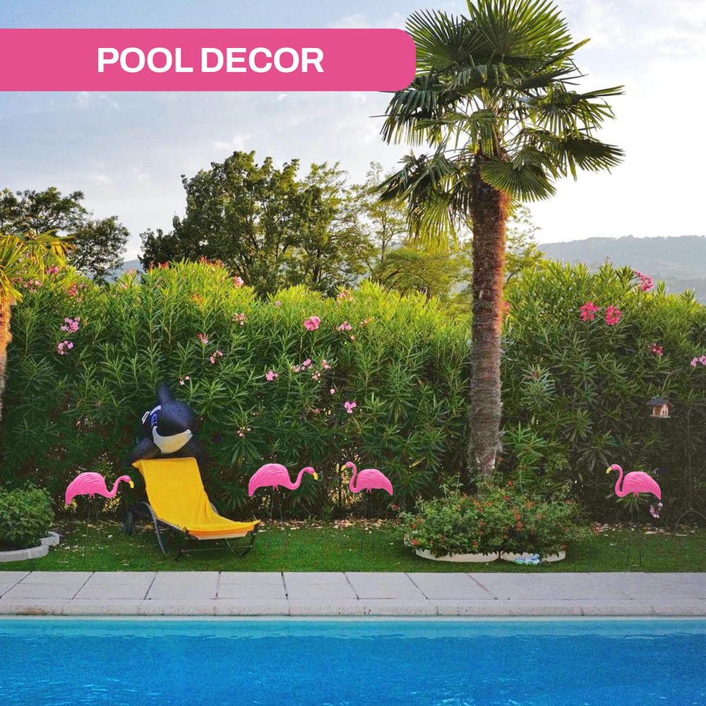 4E's Novelty four flamingos arranged in yard creating playful curb appeal