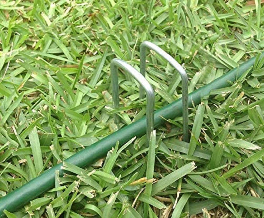 AAGUT staples holding garden bed netting in place for neat, secure landscaping