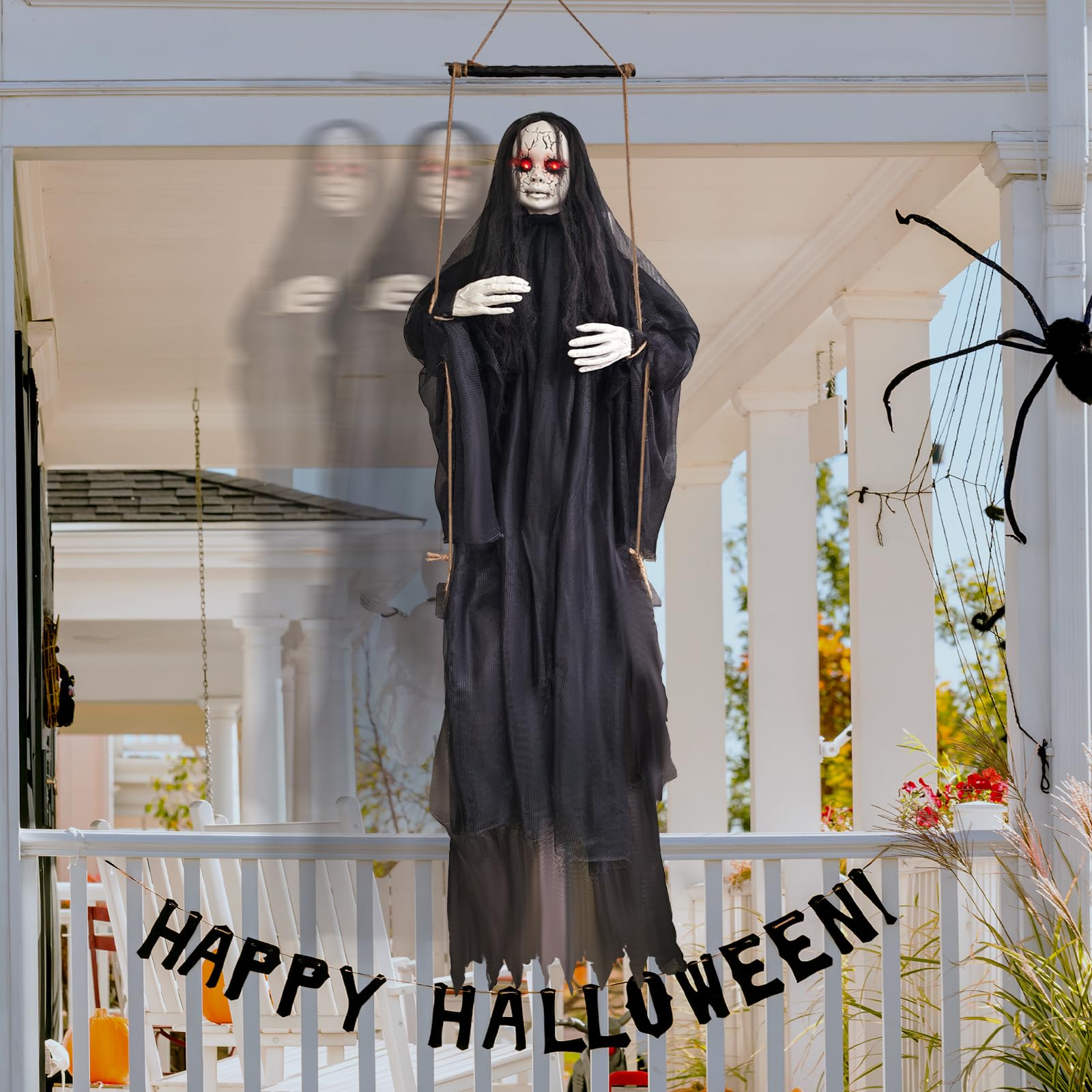 Abakuku full body hanging on a porch demonstrating life-size swing motion benefit: realistic movement to scare