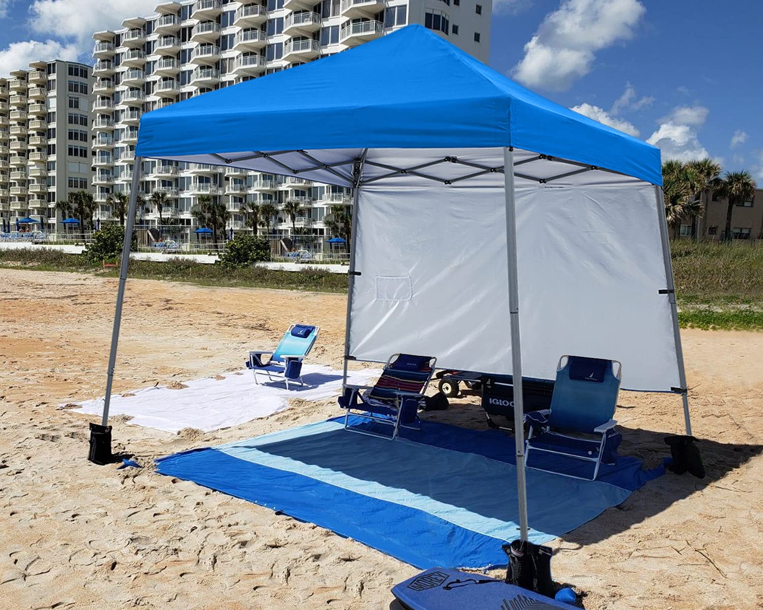 ABCCANOPY on sandy beach with family enjoying shade for convenience benefit
