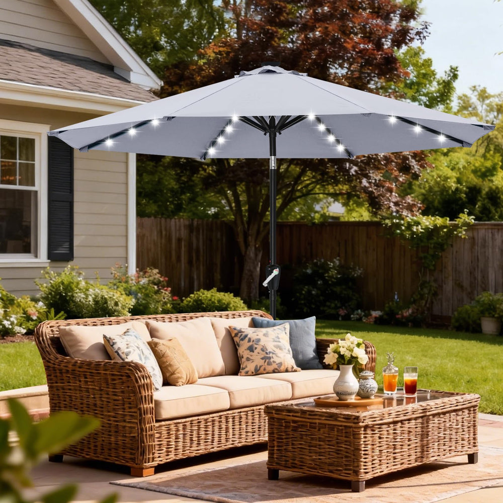 ABCCANOPY lit umbrella at dusk creating warm outdoor ambiance for dinners