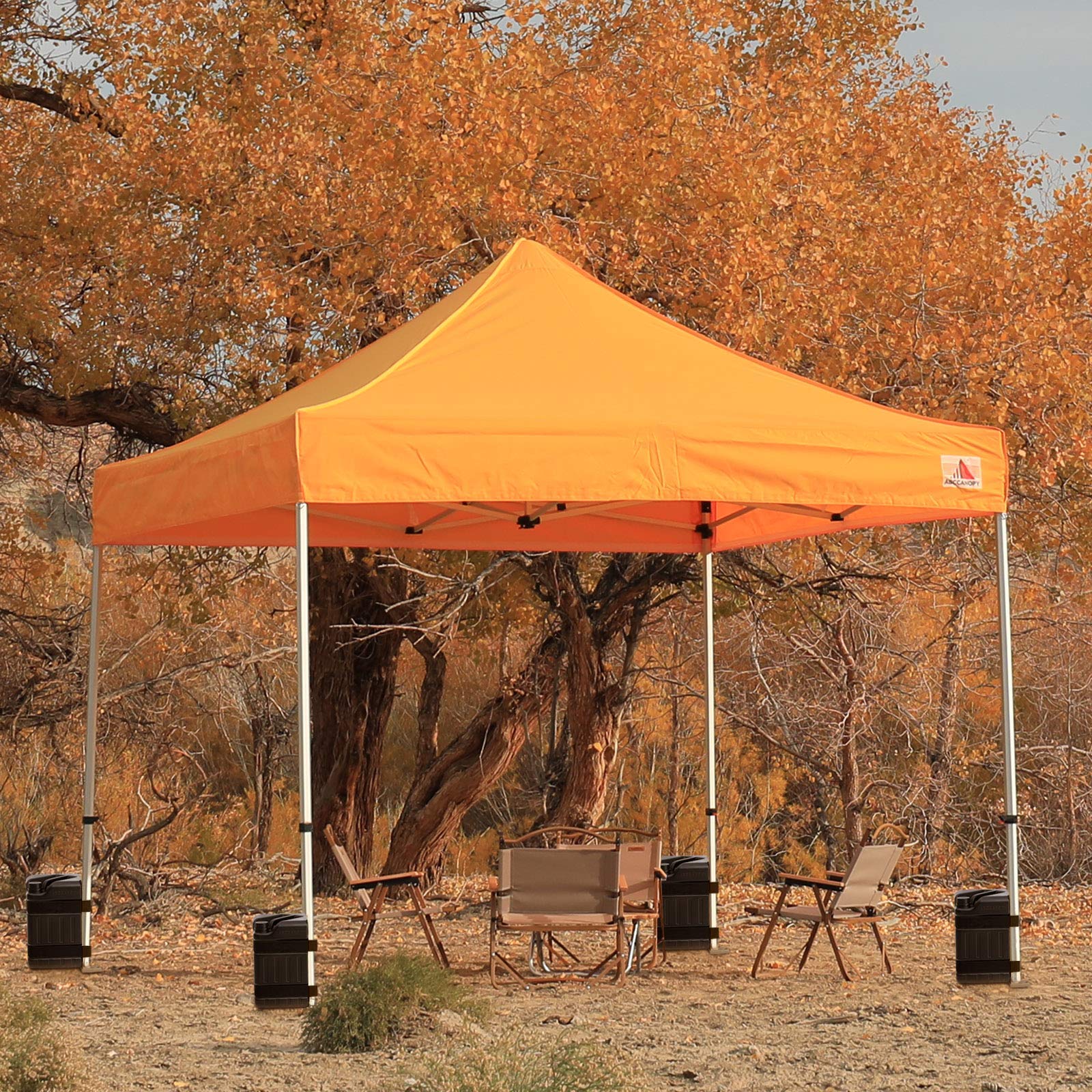 ABCCANOPY weights attached to a market booth illustrating reliable outdoor stability