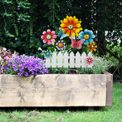 ABELOTS butterfly detail in metalwork, adds whimsical accent to garden