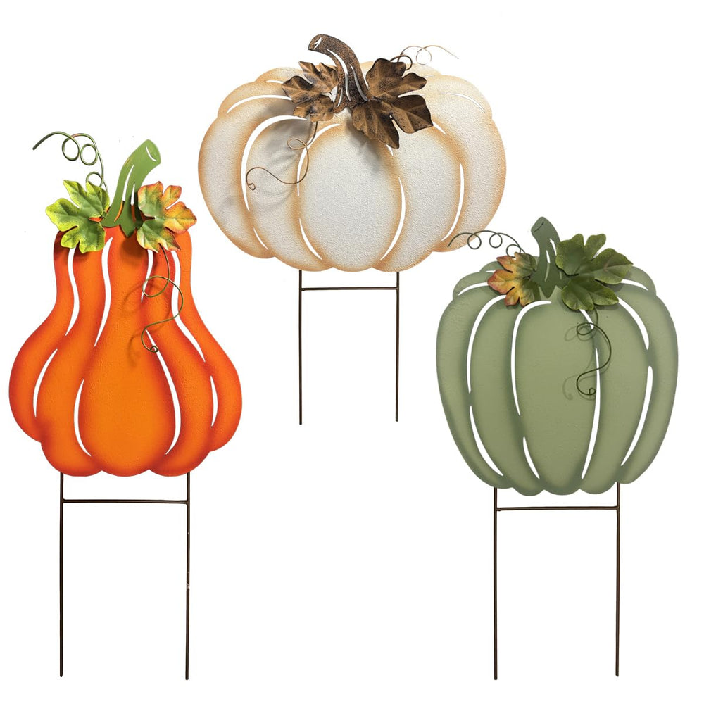 ABELOTS front view of three pumpkin stakes adding warm autumn curb appeal