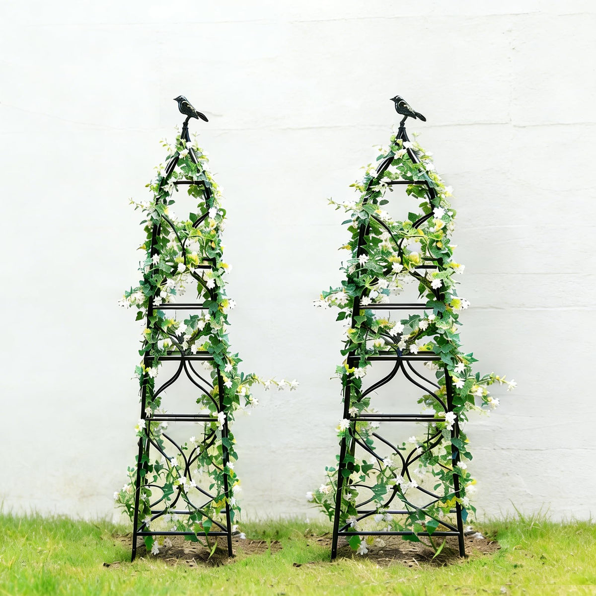 aboxoo front view paired obelisks showing decorative support and visual height