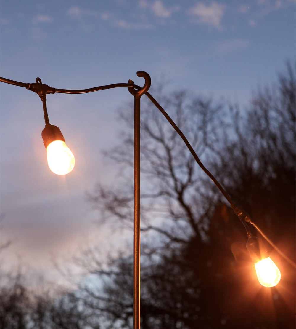 Achla Designs poles mounted on railing showing stable light-hanging benefit