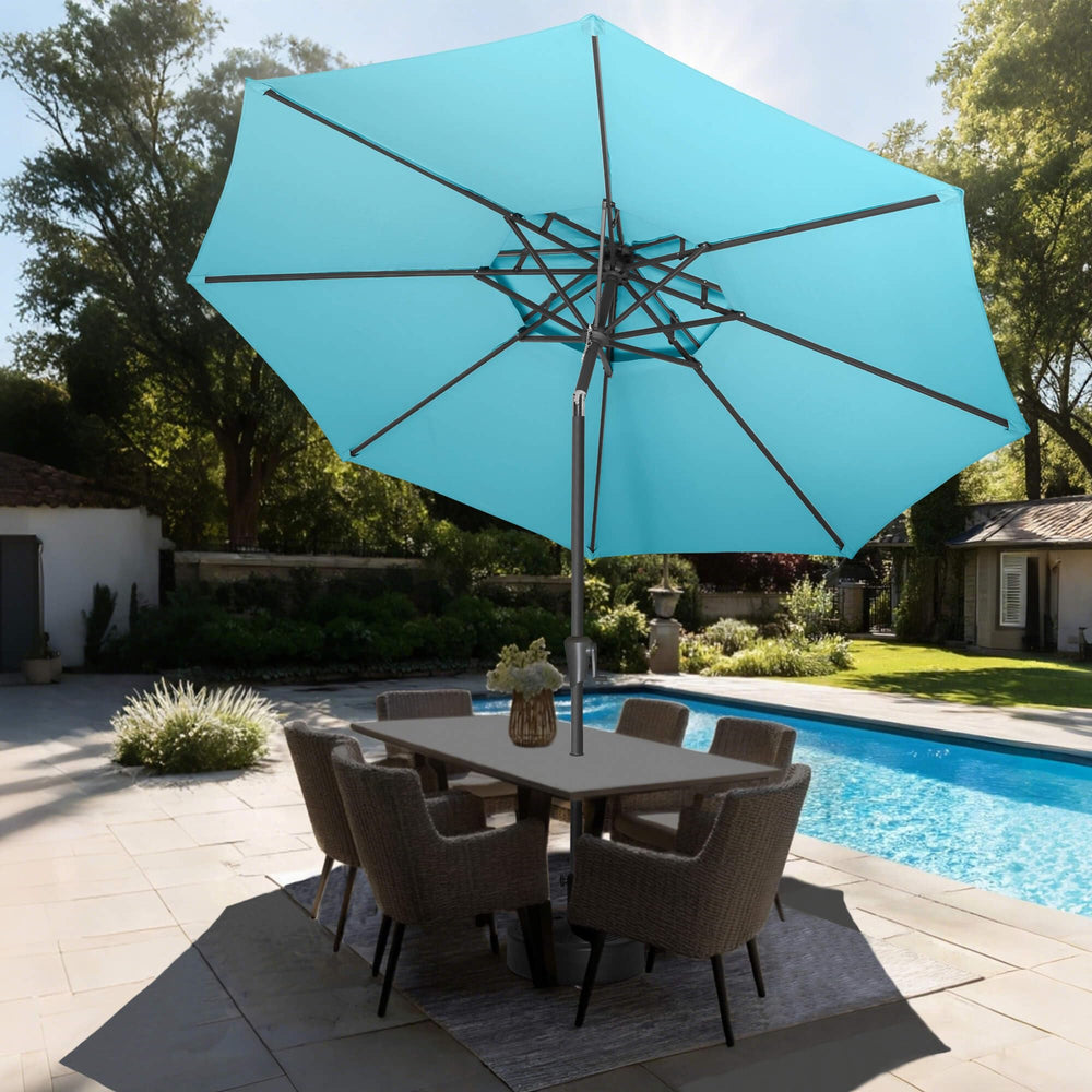 AckMizz umbrella installed over patio table providing cool shaded seating