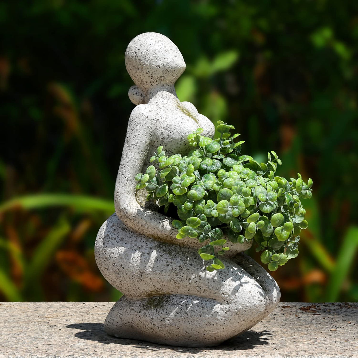 Aclema face planter front view showing sculptural head and stone-look benefit