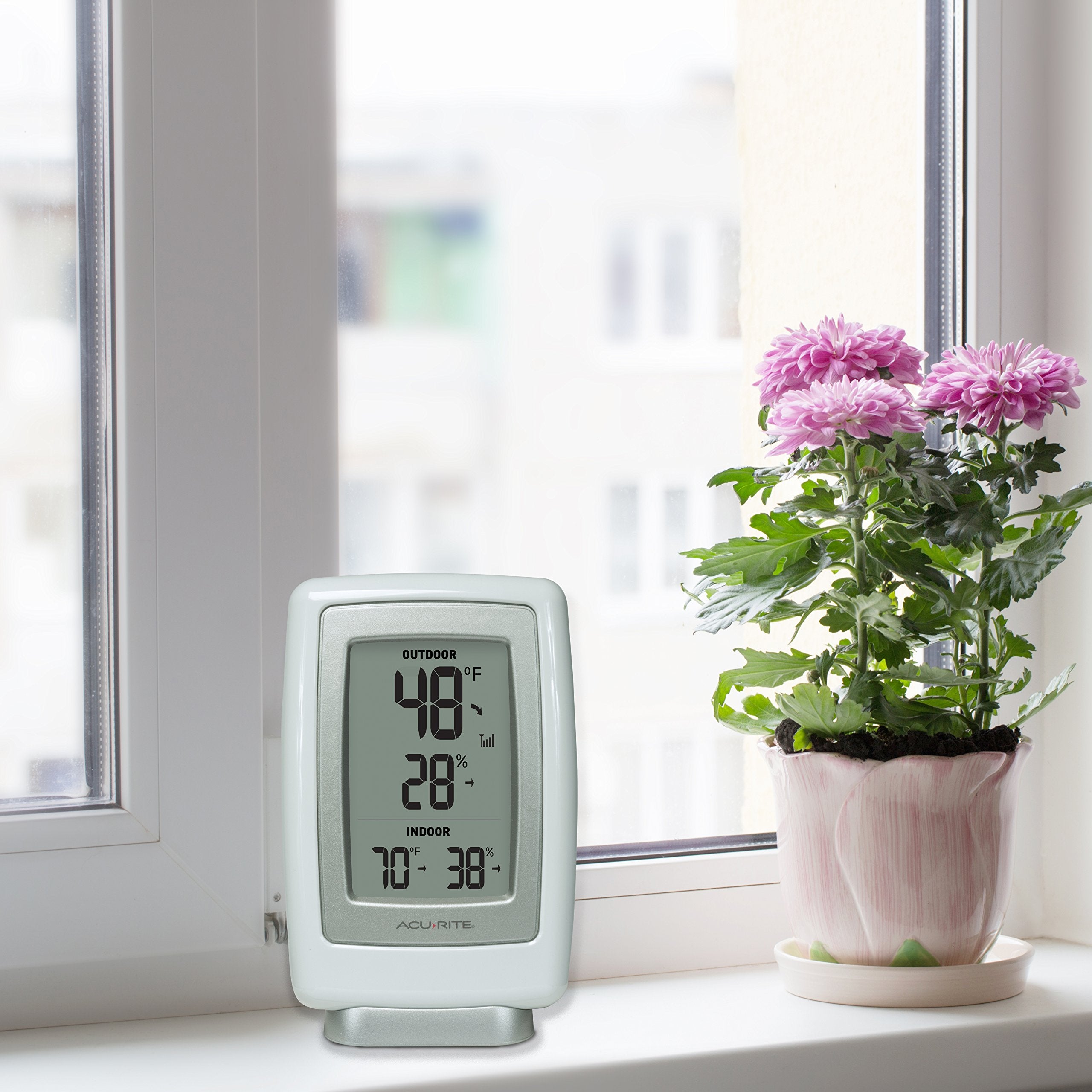 AcuRite outdoor sensor close-up highlighting weather-resistant casing and hanger for mounting