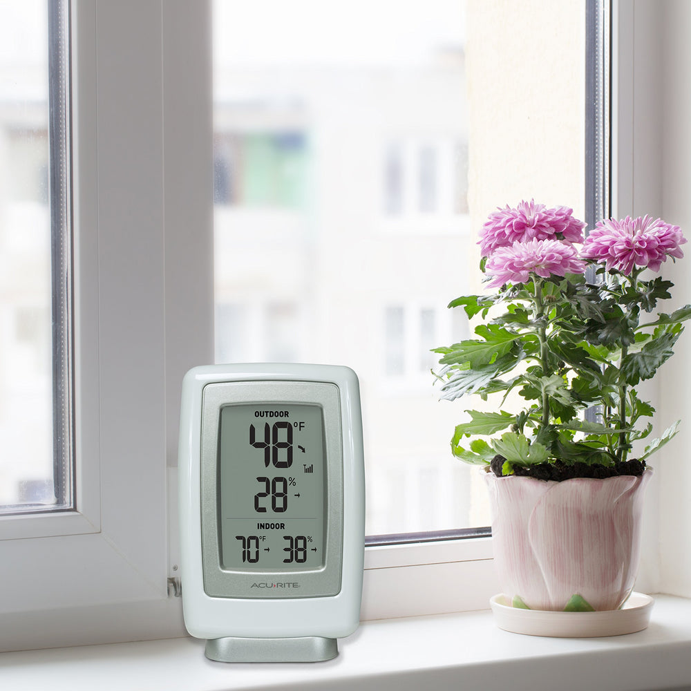 AcuRite outdoor sensor close-up highlighting weather-resistant casing and hanger for mounting