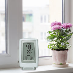 AcuRite outdoor sensor close-up highlighting weather-resistant casing and hanger for mounting