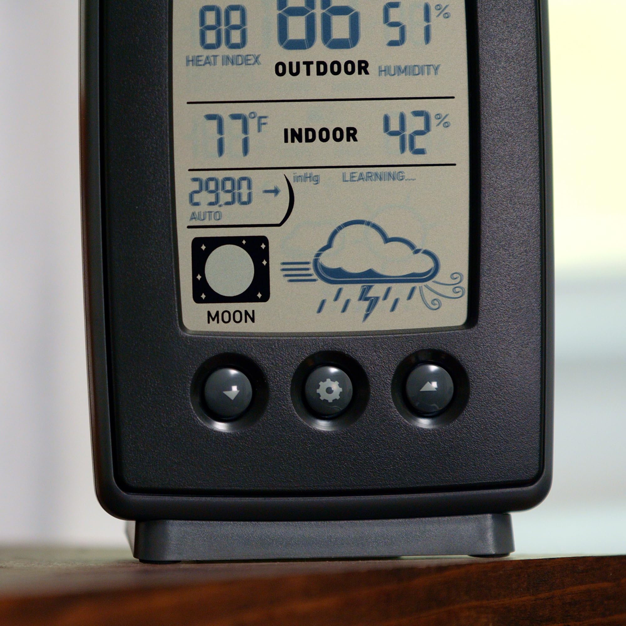 AcuRite sensor mounted on fence showing easy outdoor installation benefit