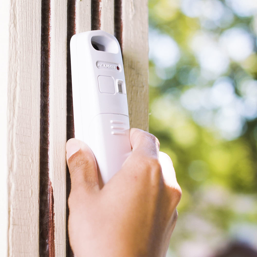 AcuRite unit with sensor beside ruler showing compact size benefit