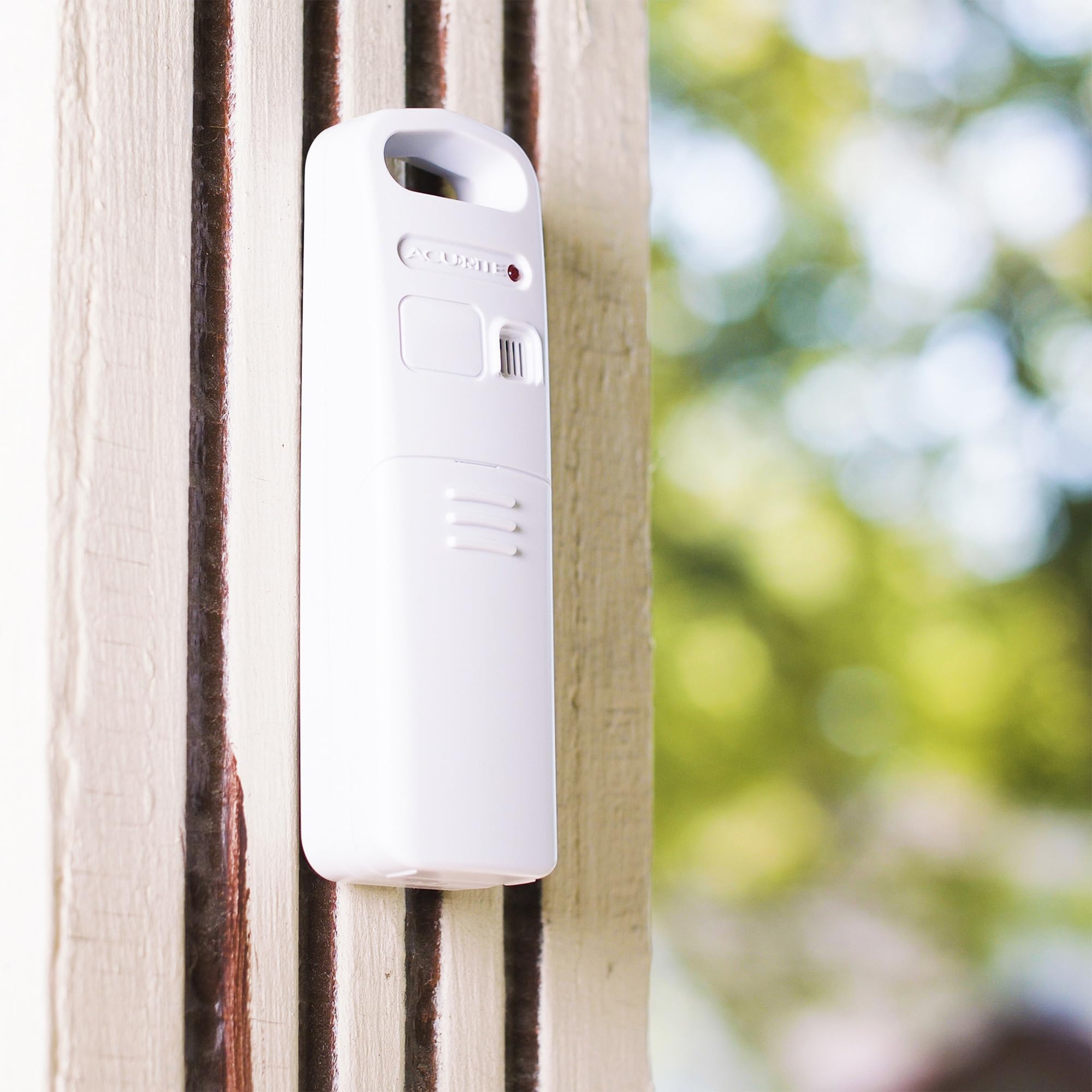 AcuRite on a styled bedside table showing integrated weather and charging