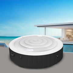Adozsb cover installed on outdoor SaluSpa tub demonstrating debris and rain protection