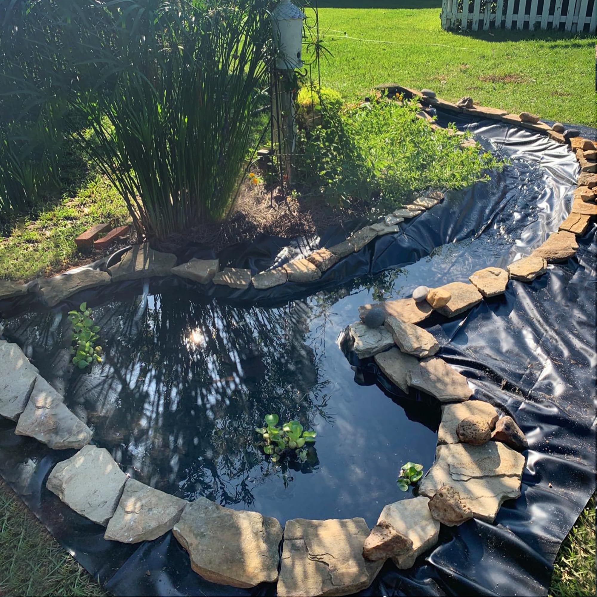 Adroiteet liner edge anchored with stones for secure finish