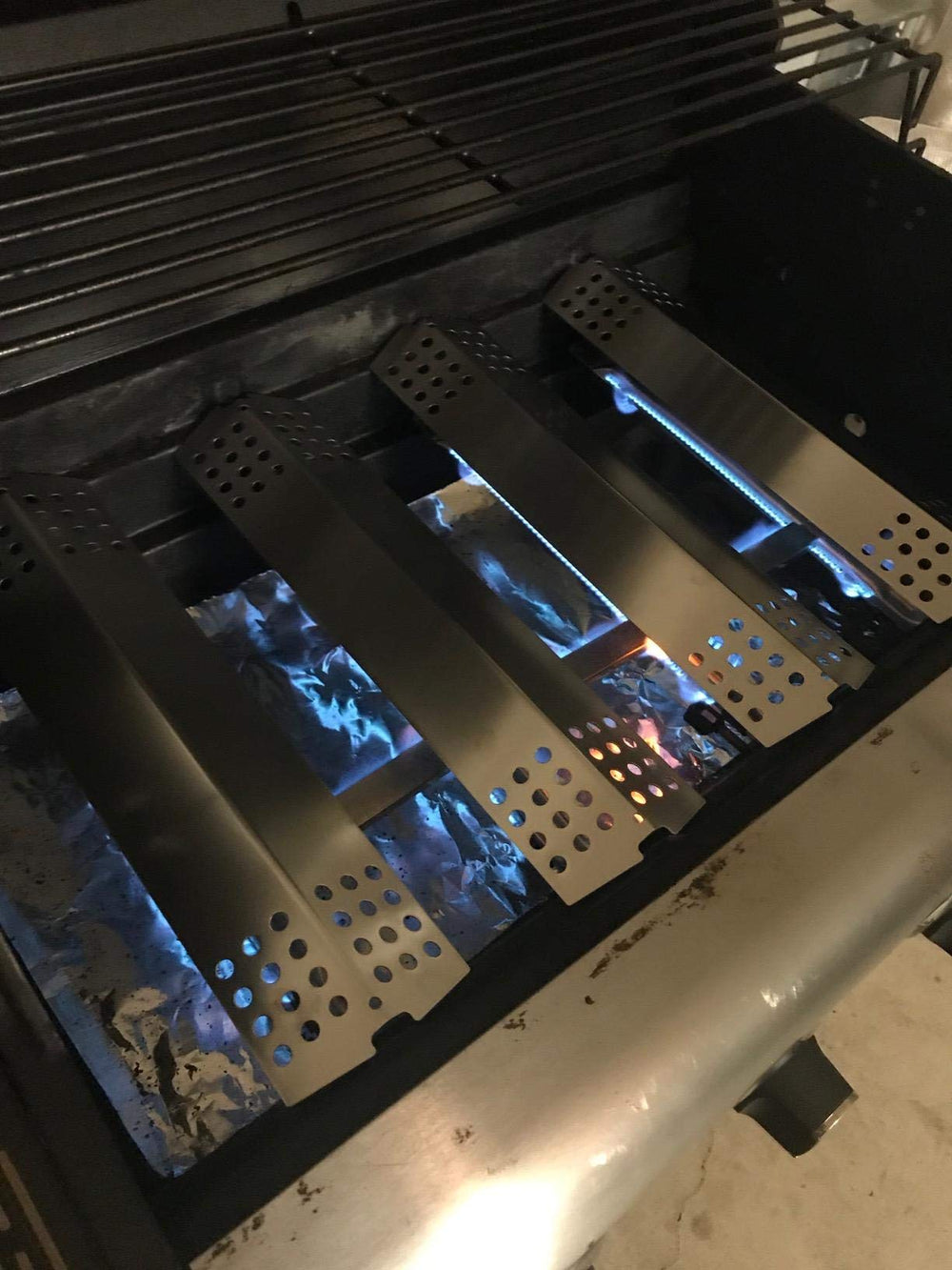 Adviace installed burner in grill showing improved flame distribution benefit