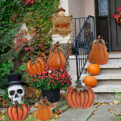 Aecipl pumpkin stake placed in garden bed offering instant autumn color to pathway
