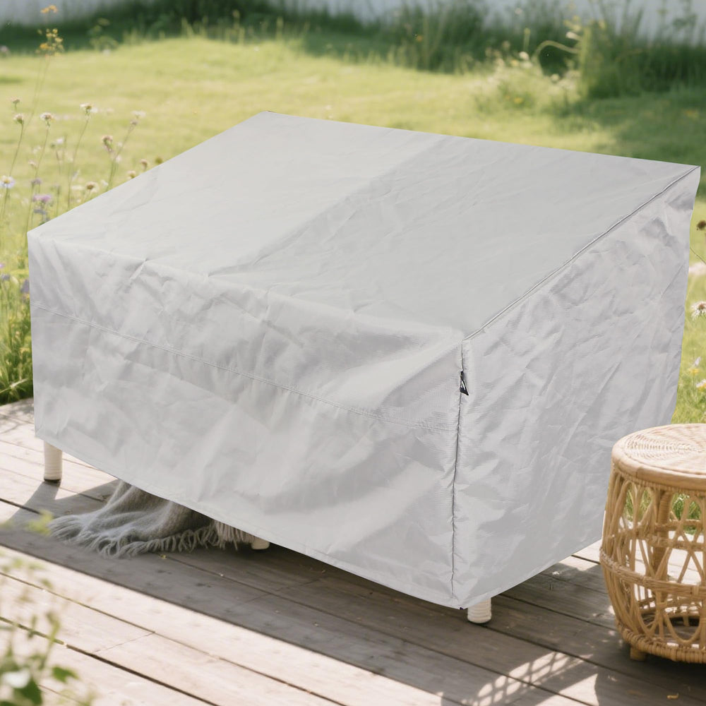 AEGIS COMFORT CARE cover on patio loveseat in lifestyle scene protecting cushions