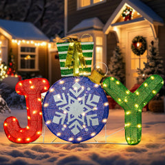 Afirst front view of JOY decoration showing glittered letters and festive appeal