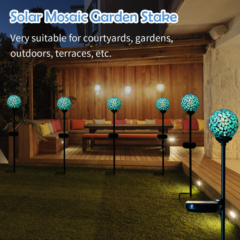 Afirst stake supporting tall plants and providing subtle garden lighting