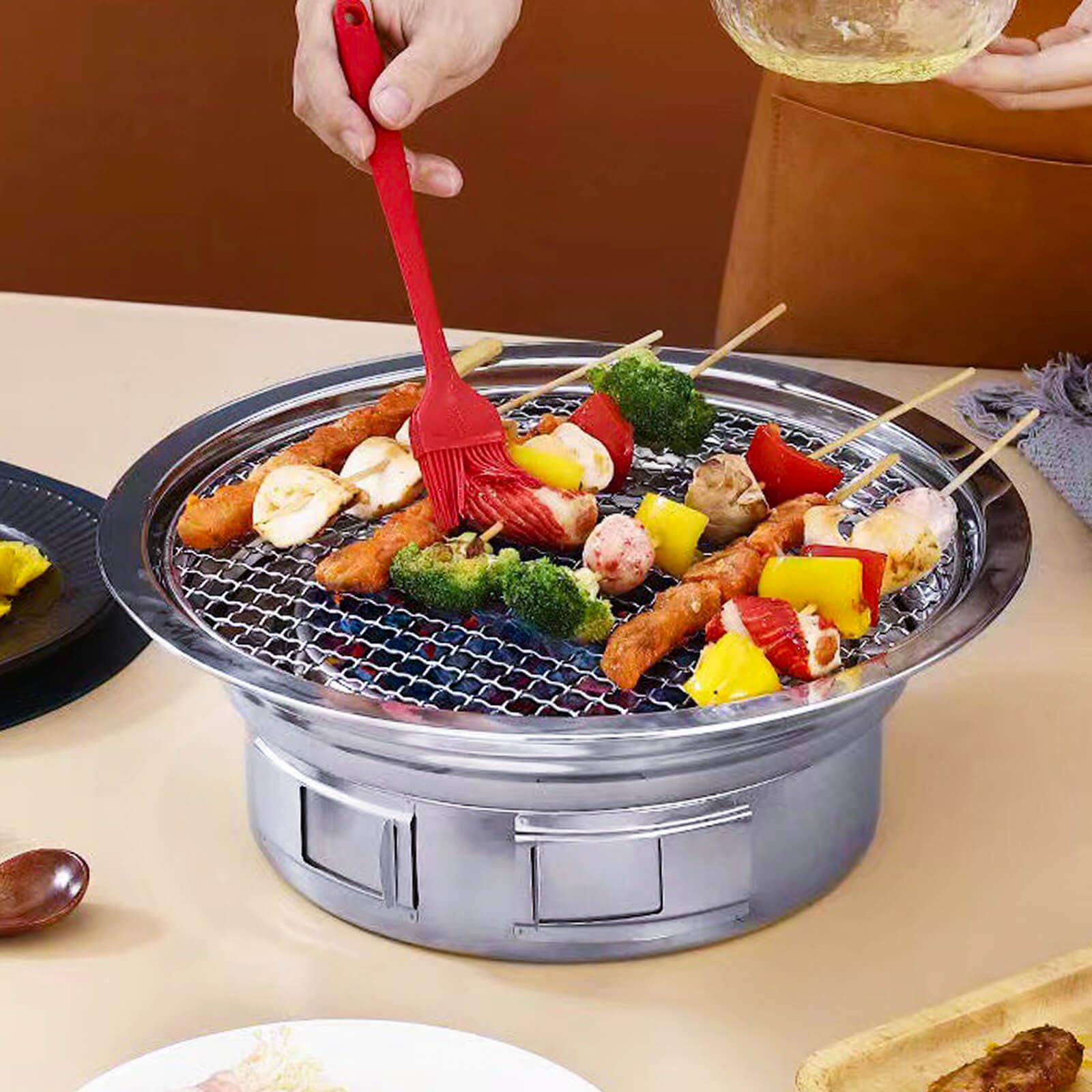A.F.N.A.L grill with net and pan setup showing versatile cooking options