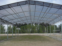 Agfabric installed on pergola top providing cooler shaded patio benefit