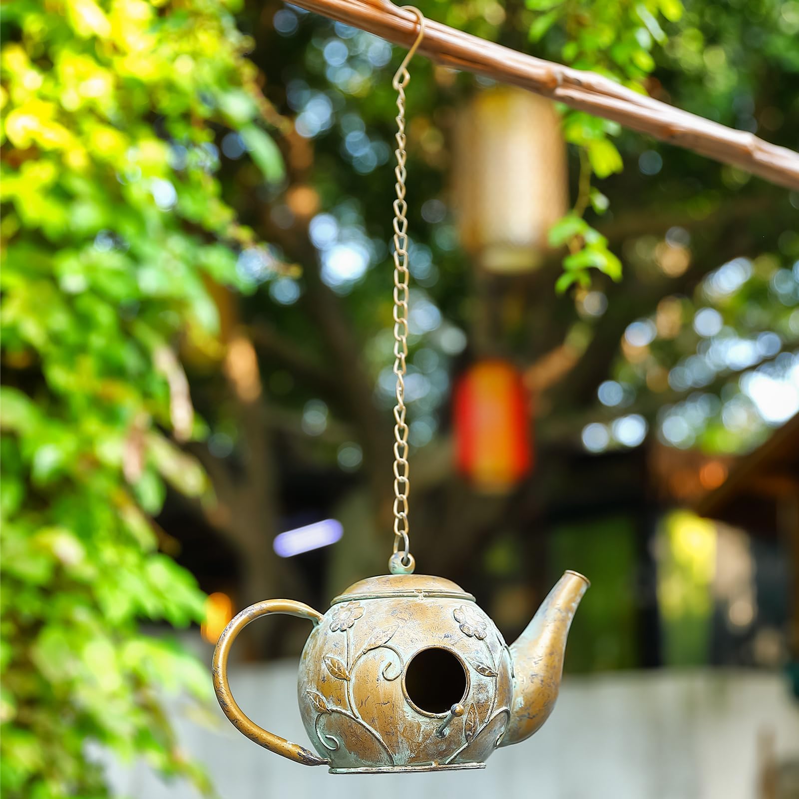 Aifeorzo teapot birdhouse scale with hand showing compact, bird-friendly size
